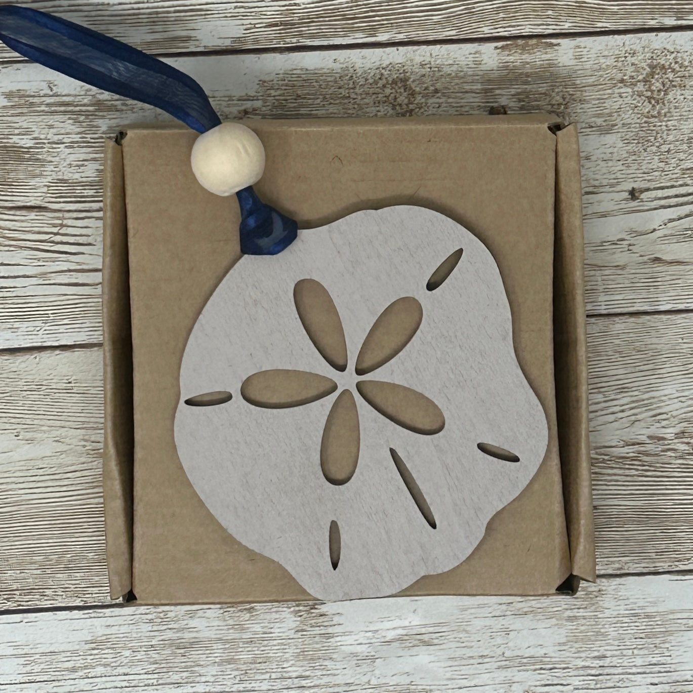 The Seashore Treasure Sand Dollar Journey to Enlightenment Wood Story Ornament