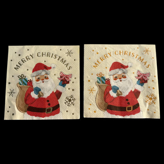 Two Close-ups of cocktail napkins featuring a retro Santa Claus holding a gift and sack of presents with gold foil “Merry Christmas” text and snowflake accents.