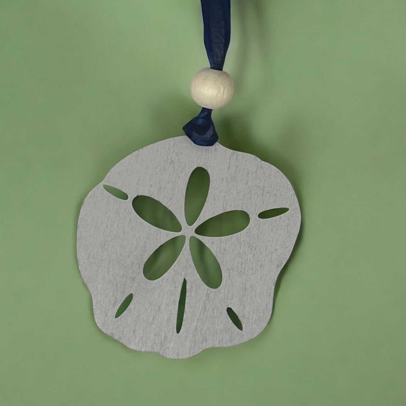 The Seashore Treasure Sand Dollar Journey to Enlightenment Wood Story Ornament