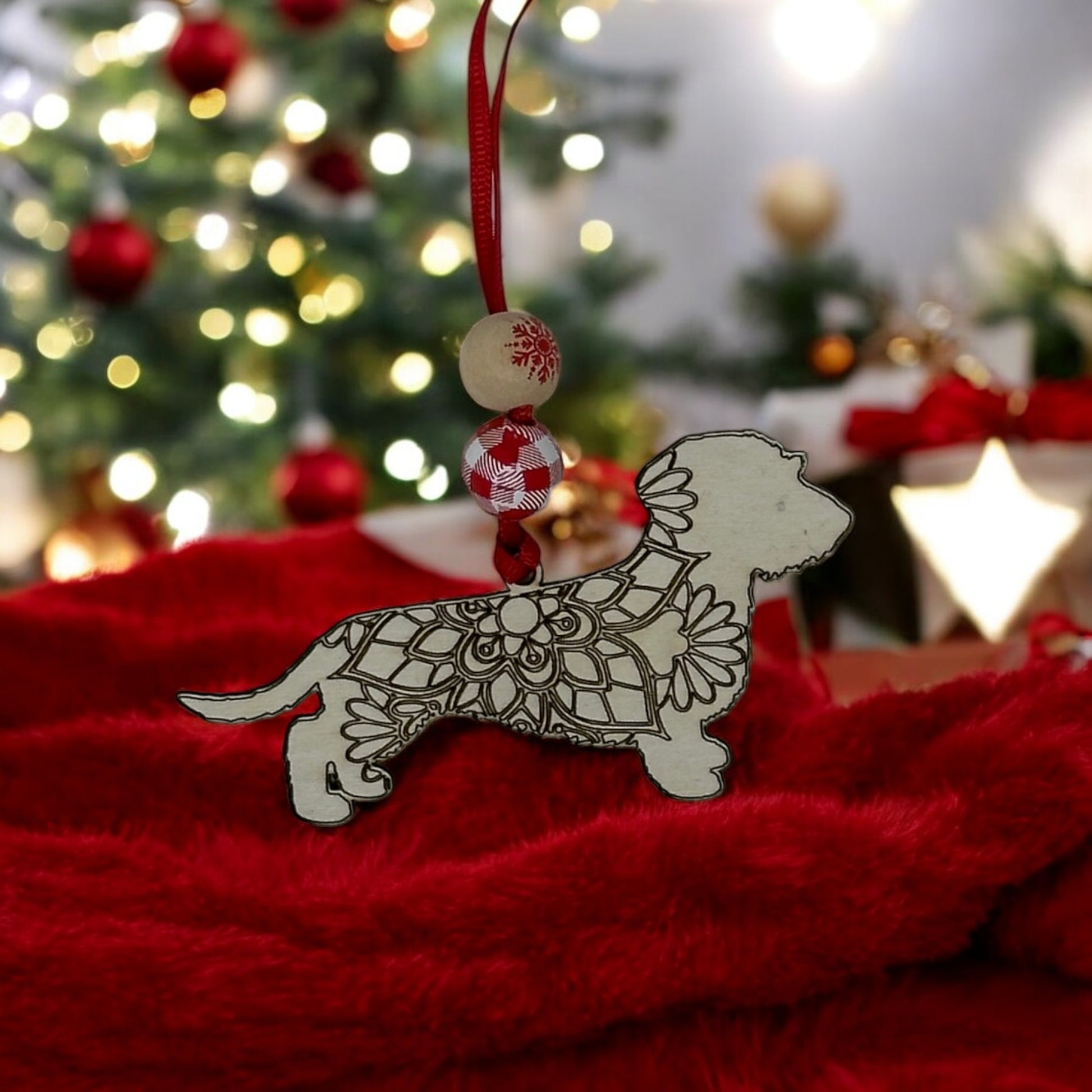 Handcrafted wooden wire-haired Dachshund ornament with floral mandala design, gift-boxed with story card.