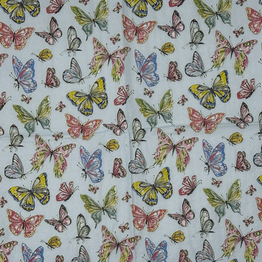 Butterfly patterned paper on a wooden surface