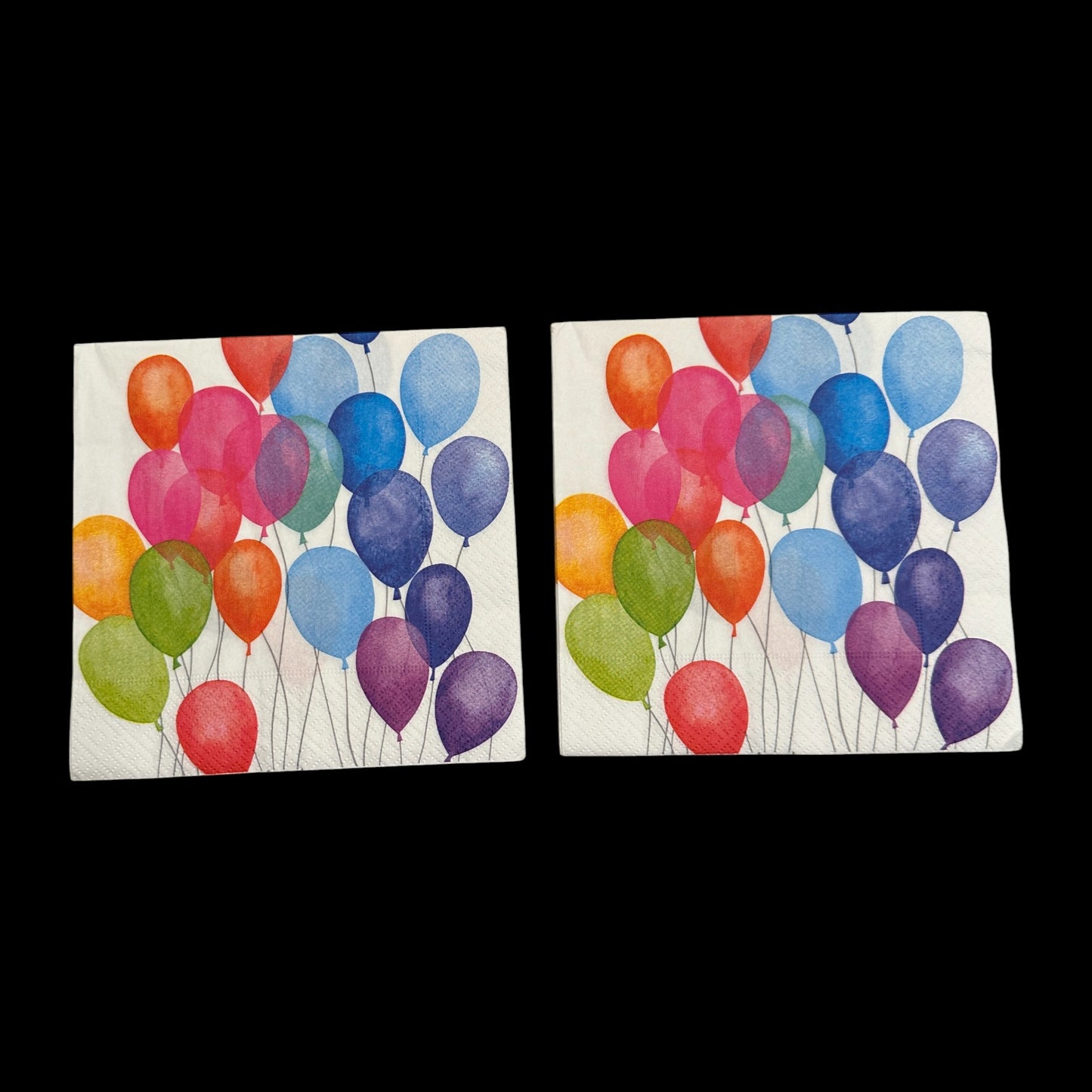 Two Luncheon size decoupage napkin featuring colorful balloons in red, orange, green, blue, and purple for birthday, party, and celebration crafts.