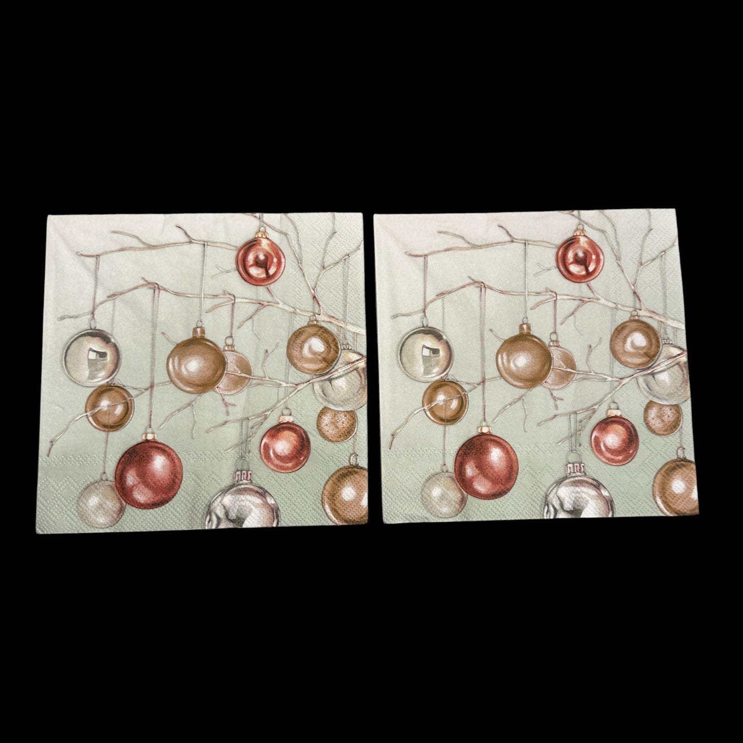 Two Luncheon size decoupage napkin featuring metallic copper and gold Christmas baubles hanging from branches on a soft green background for holiday crafts.