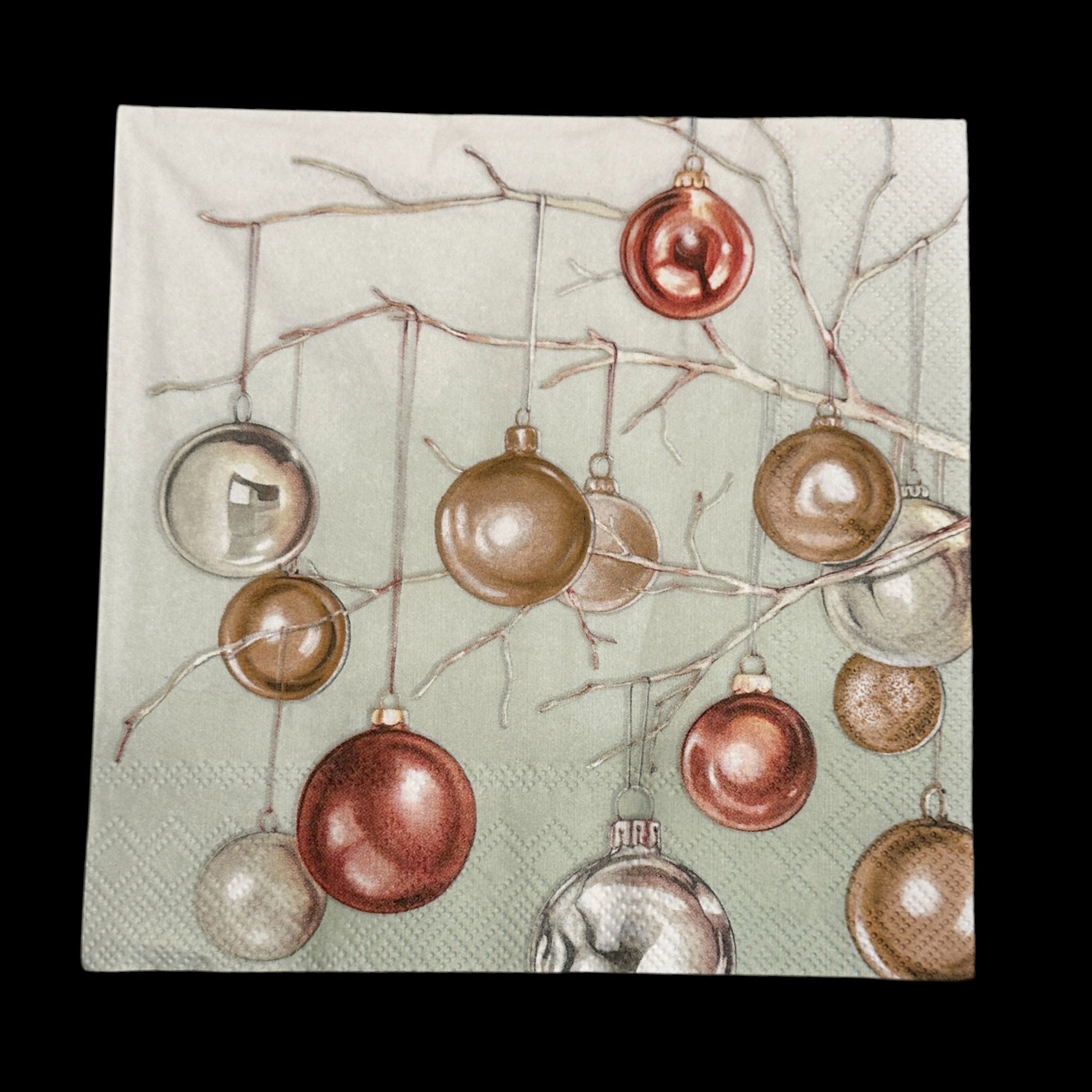 Luncheon size decoupage napkin featuring metallic copper and gold Christmas baubles hanging from branches on a soft green background for holiday crafts.