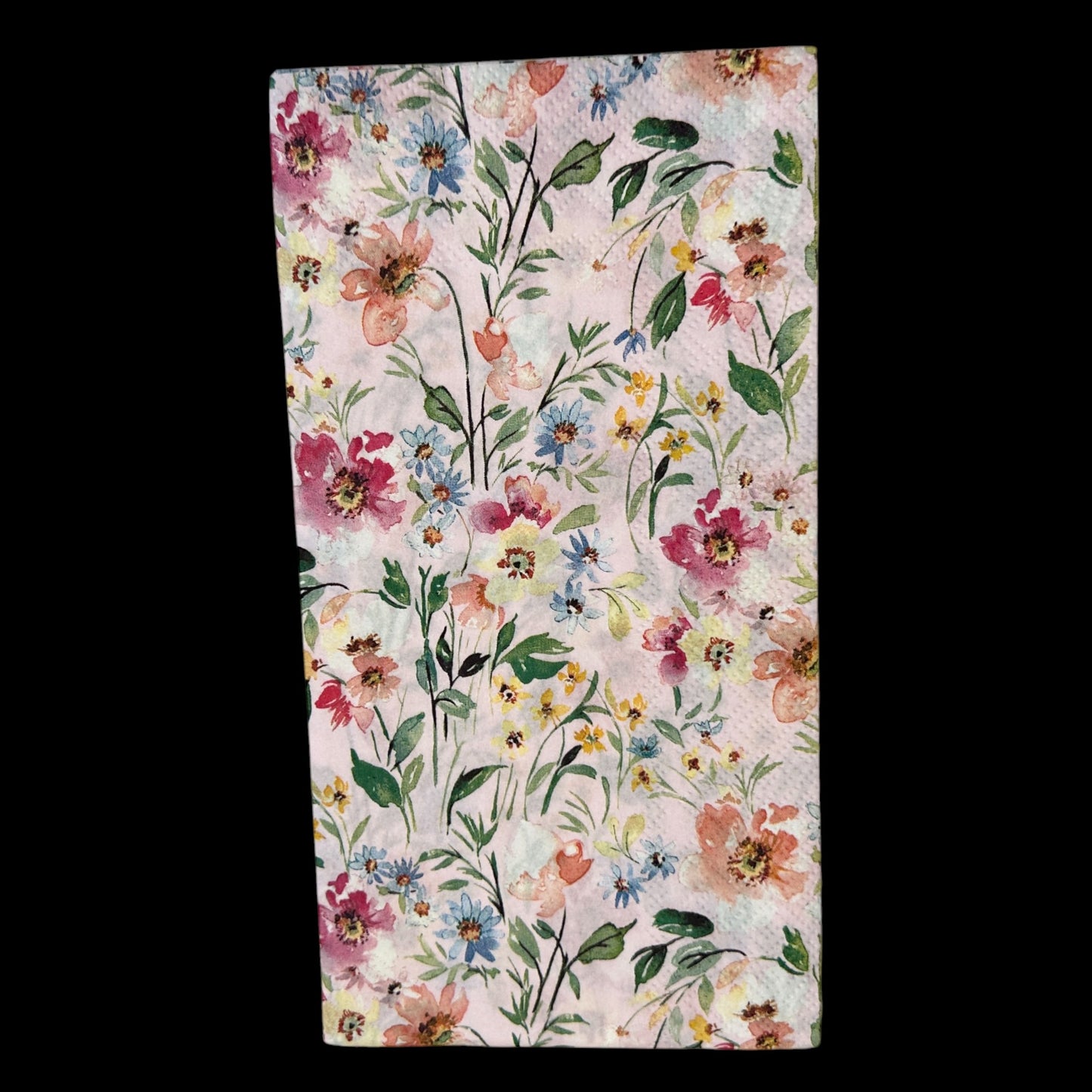 Guest size decoupage napkin featuring watercolor flowers in pink, rose, blue, and yellow on a soft blush background—perfect for spring floral crafts.