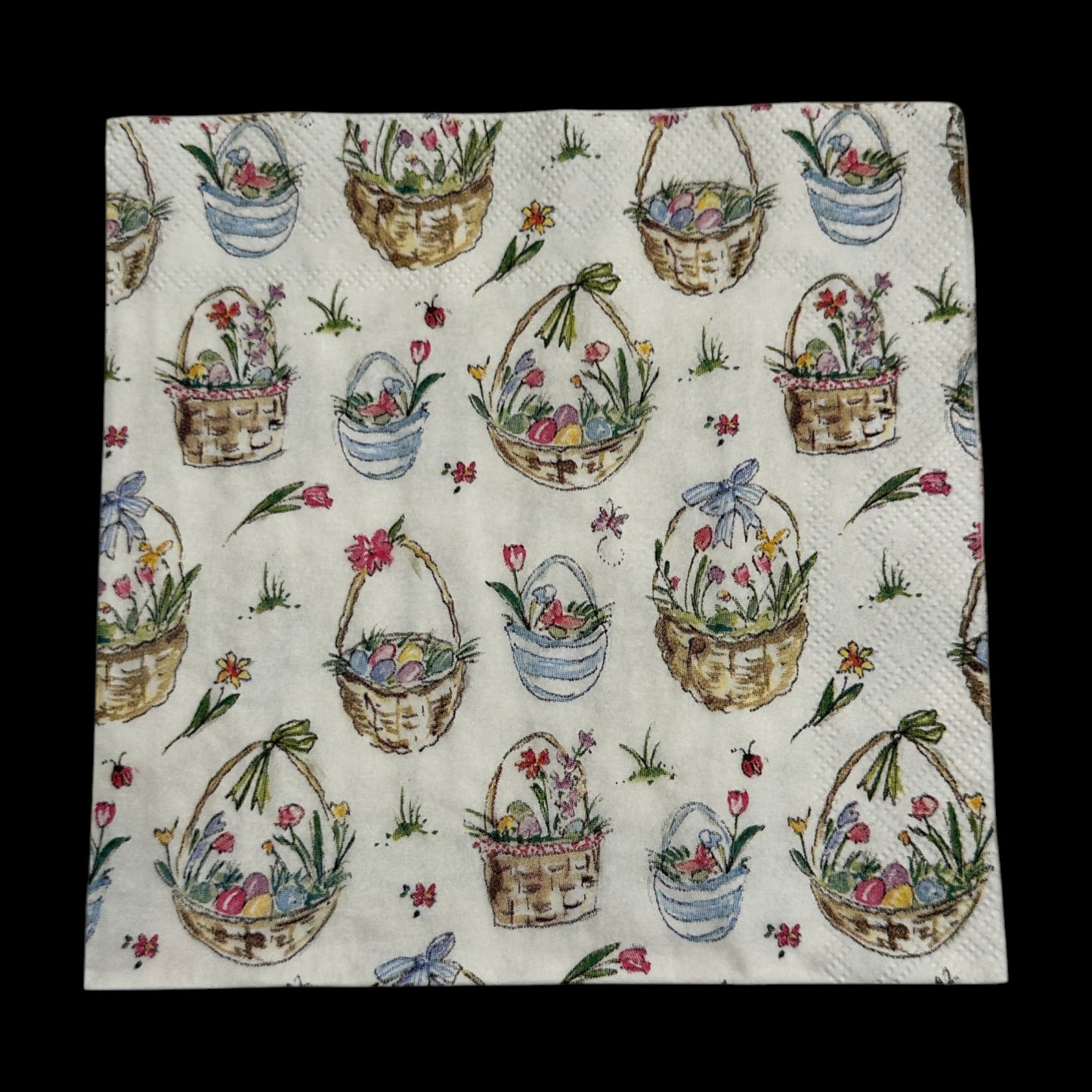 Cocktail size decoupage napkin featuring Easter baskets filled with flowers, eggs, and ribbons on a white background for spring and Easter crafts.