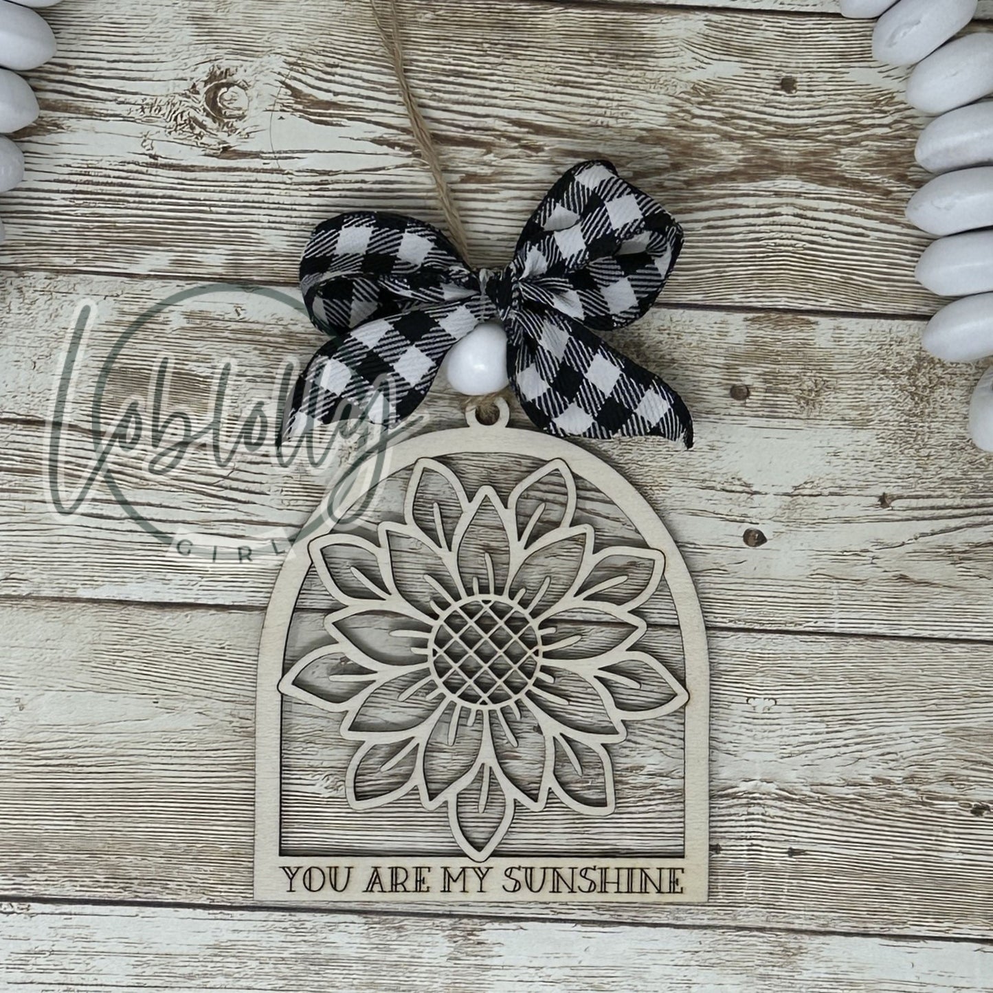 Adorno de madera con forma de girasol y sonrisas besadas por el sol. Eres mi sol